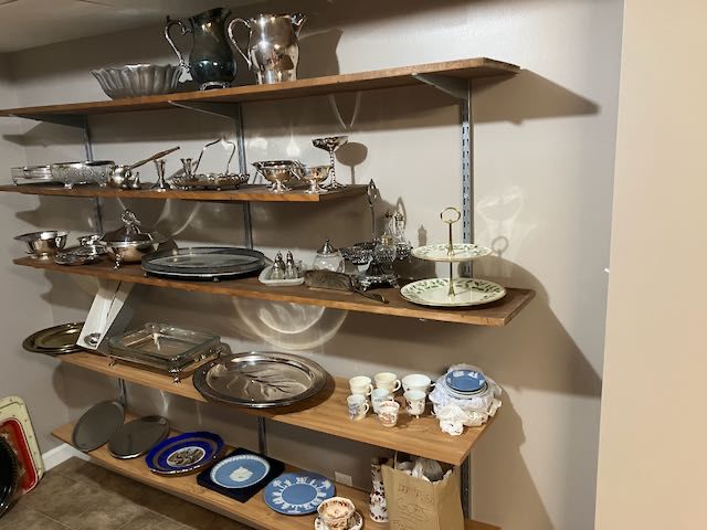 Silver pitchers, platters, serving trays, bowls, gravy boats, ladle, demitasse coffee cups, Wedgewood plates, holiday china  tiered platter, candlesticks 