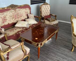 Exquisite French-Style Parlor Set with Floral Upholstery and Matching Coffee Table
This stunning parlor set exudes timeless elegance and will add a touch of sophistication to any living space. The set includes a loveseat, two armchairs, and a matching coffee table, all meticulously crafted with a French-inspired design.
