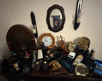 GE Radio with a Heritage GE7-4100J; Mens Avon Decanters (both full and empty); Howard Miller Quartz Desk Clock