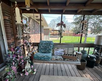 Wooden Porch Swing; Chair Cushions; up Wind Chimes; Pepsi Crate (Alton); Artificial Flowers; Wood Bee Catcher; Metal Milk Cans; Water Pump Lamp; Metal Watering Cans; Wreaths