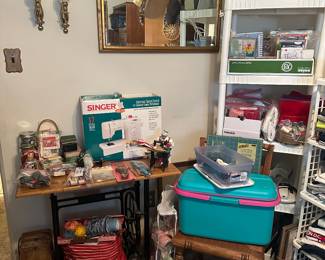 Singer Electronic Speed Control Sewing Machine 2517; Antique Singer Metal Sewing Machine Base Table; Sewing Boxes; Yarn; Fabric; Wall Mirror; Sconces; Picture Frames; Greeting Cards; Buttons; Glue Guns; Wooden Spools; Scissors; Electric Pencil Sharpener; Olga Self Healing Rotary Mat; Sewing Supplies