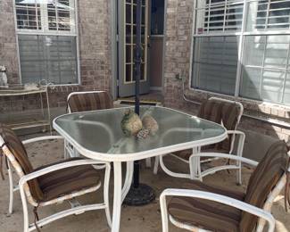 QUALITY PATIO TABLE AND 4 ROCKER CHAIRS AND UMBRELLA  NOT LIGHT WEIGHT  NICE SET