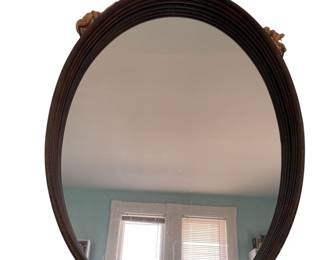 Metal oval mirror on a nautical rope