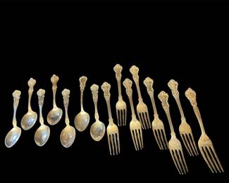 Antique Repoussé sterling silver spoons 
and forks 