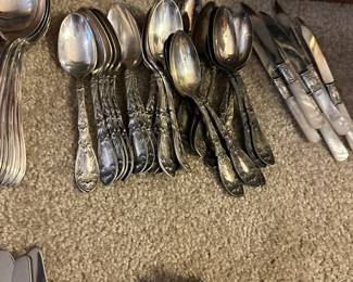 silver plate utensil sets in several patterns