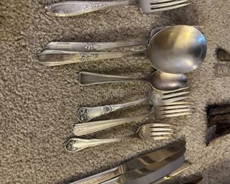 silver plate utensil sets in several patterns