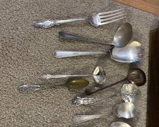 silver plate utensil sets in several patterns