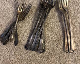 silver plate utensil sets in several patterns