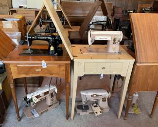 Large variety of sewing machines with tables