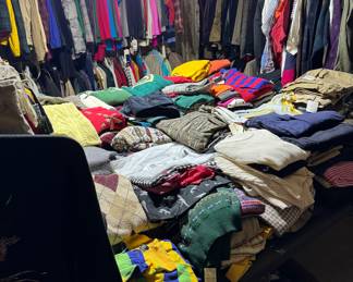 Huge room of clothing. Most are Polo Ralph Lauren new with tags