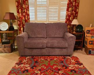 New Ashley Loveseat, several area rugs