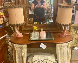 Pair of ceramic dresser or vanity lamps
Kidney shaped skirted dressing table
Ornate mirror
Vanity chair