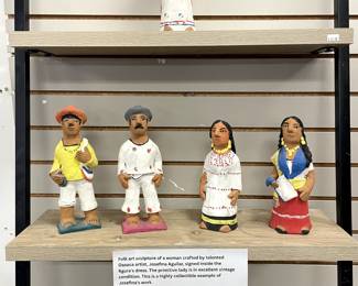 Folk art sculptures by talented Oaxaca artist, Josefina Aguilar, signed by artist.
"Josefina Aguilar is a Mexican folk artist from Ocotlán de Morelos, Oaxaca. She is best known for her small clay figurines, called muñecas, an art form she learned from her mother Isaura Aguilar. Aguilar uses red clay to create depictions of everyday village activities, religious and folkloric scenes, famous figures and special Day of the Dead statues. Collectors of her work have included Nelson Rockefeller, who discovered her work on a trip to Oaxaca in 1975 as well as repeat visitors to Oaxaca, who come to see her latest work. Children's book author Jeanette Winter has written and illustrated a counting book inspired by Aguilar's life and work."