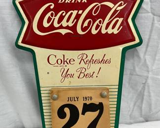 Embossed Coca-Cola Fishtail Calendar Plaque, July 1970, 9″ x 14″