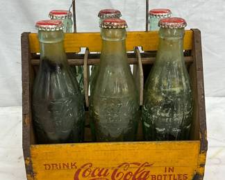 Wooden Coca-Cola Bottle Carrier with Six Glass Bottles, Metal Handle, and Red Caps