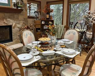 Rattan dining set- oval glass table and 4 chairs.  Chair pads can easily be changed to whatever fabric coloring fits your style.  Great for a sun room, kitchen or any other room.