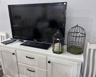 White buffet and TV