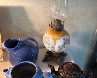 A nice blue HULL water pitcher in the back. The vintage oil lamp in the back is beautiful!