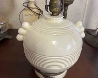 This is a lovely vintage stoneware lamp! Off-white in color