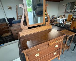 This is a fairly large dresser with the top mirror