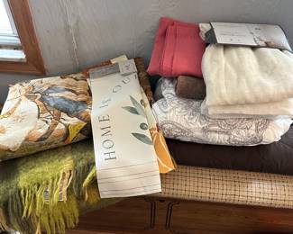 This is the cedar chest we saw previously on top of nice blankets and throws!