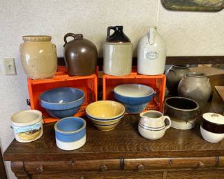 The buffet in the dining room is a perfect place to display all the beautiful crockery we have. Balls, crocs, pitchers, and jugs.
