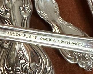 This is a large set of Oneida Tudor community plate flatware with extra pieces