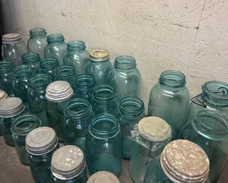 A large collection of vintage blue ball jars