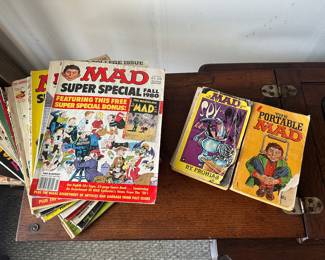 A great set of vintage mad magazines, and mad books