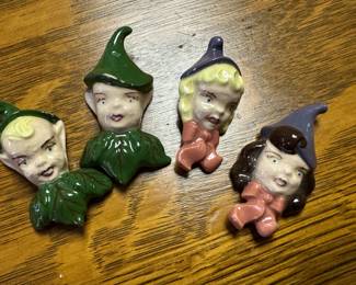 Here we have four little pixie heads that are actually lapel pins! Two boys and two girls! All marked on the bottom!