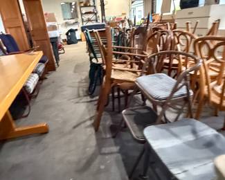 A long shot of the 3 1/2 car garage filled to the rim with vintage furniture and more