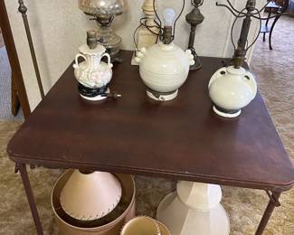 Here’s a nice table full of vintage lamps! Under it are some great vintage lampshades!