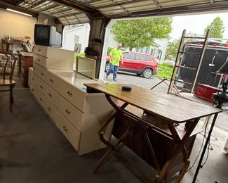 It’s a three-piece white bedroom set and of course that DG Arnold’s table