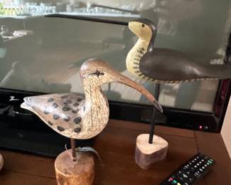 I love these two hand carved birds on bases