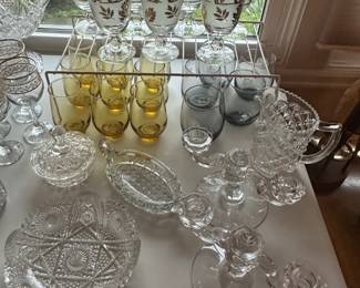 At the top of the picture are some great vintage mid-century modern pieces. The gray glasses to the center right our Detroit Lions glasses.