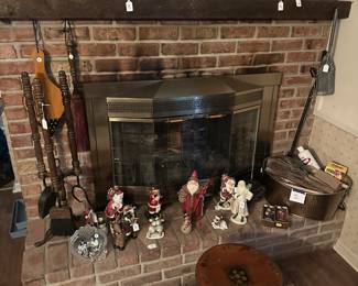 The fireplace mantle holds lots of tchotchkes of all shapes and variations