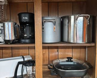 There’s a nice electric skillet, Mr. coffee, coffee maker, and large stock pots