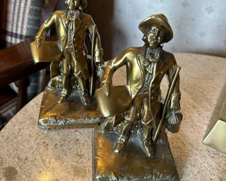 This a pair of brass candlesticks
