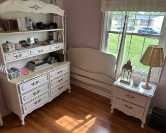 This is a lovely three-piece bedroom set for a young lady and the French provincial style white with gold trim! Full size bed, dresser with top shelves and a nightstand! In excellent condition.