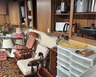 A wide shot of the basement the cupboards here are used for larger items