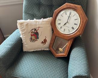 We have two of these green swivel rockers. They’re in fantastic condition. A nice pendulum wall clock.