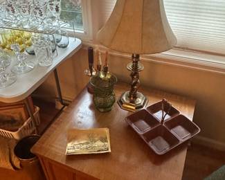 In the living room, there’s lovely furniture, including a full sofa and two fantastic rocker recliners. In this pic, we have a great wooden end table