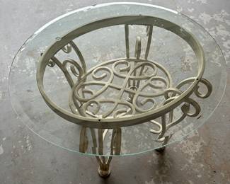 Here is an heavy rot iron with glass top patio end table