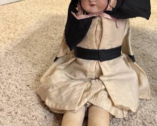 Antique Doll with Bisque head with Leather Body.
