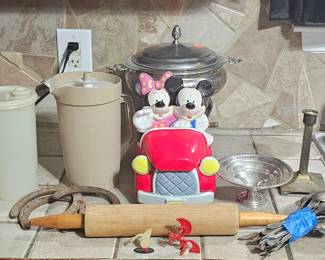 Mickey & Minnie Mouse ceramic cookie jar, antique sterling silver flatware, Tupperware pitchers, brass candle holder, wood rolling pin