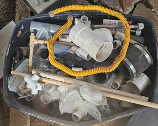 box of plumbing hardware - PVC, gas lines, assorted sizes