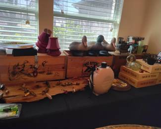 Display of hunting items such as duck decoys, ammo boxes and wooden pie boxes