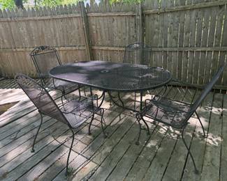 Wrought Iron Rounded Rectangular Outdoor Table with Wrought Iron Outdoor Armchairs (4 Total)