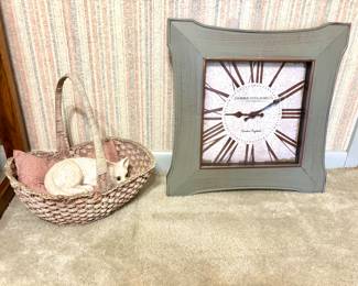Cat in a basket and a clock 