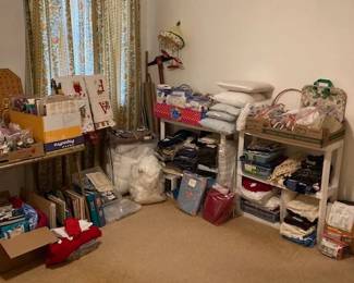 Lots of material yardage and scraps and other sewing items.